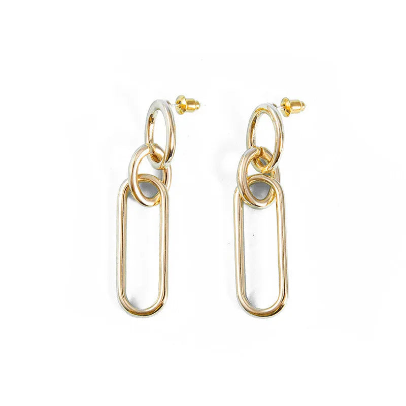 Sterling silver geometric hoop earrings with needle posts and ring-line design