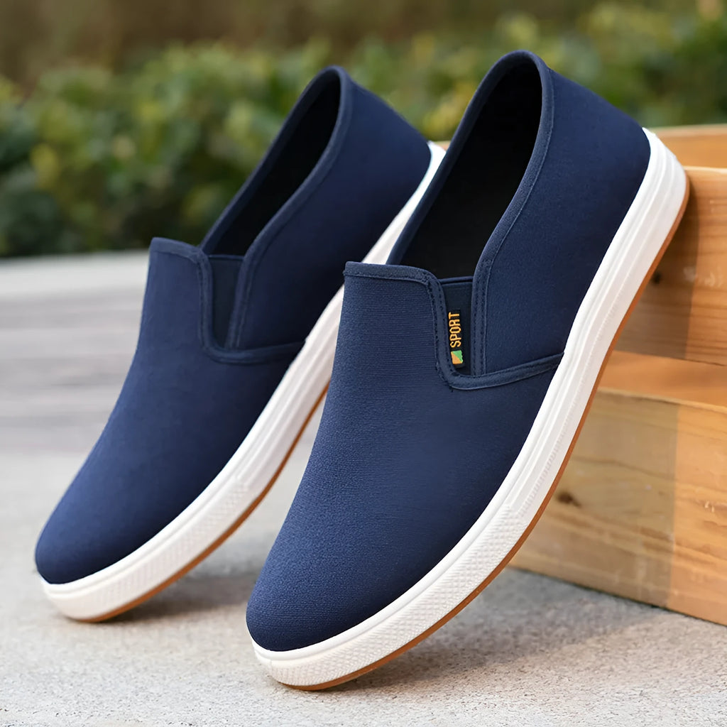 Men's black canvas slip-on shoes with round toe and shallow mouth design