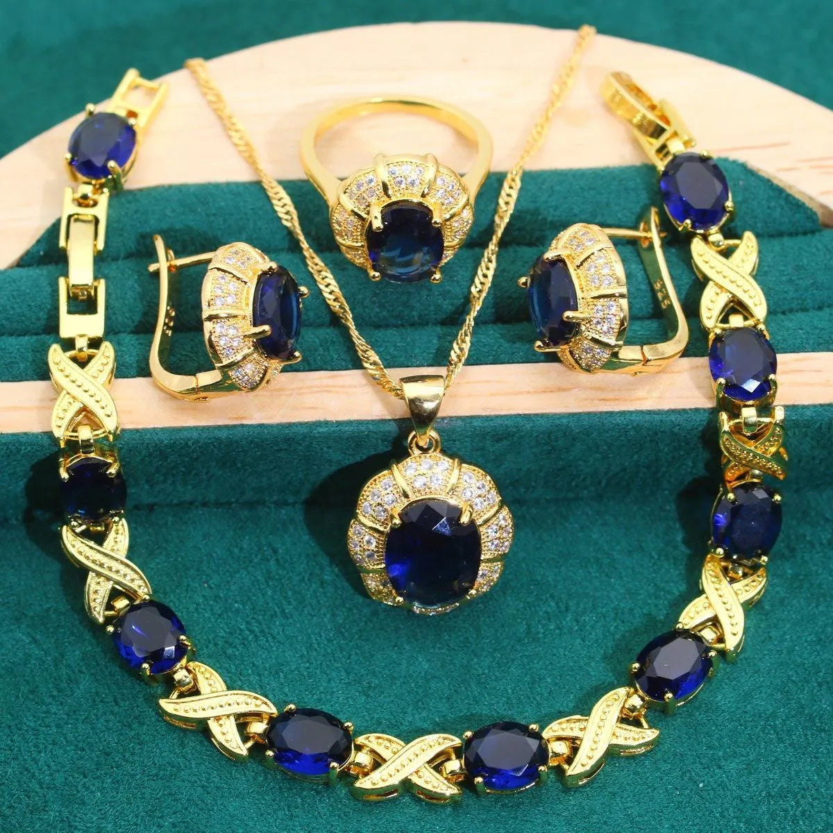 18k gold plated jewellery set with ring, earrings, bracelet and necklace featuring coloured zircon stones.