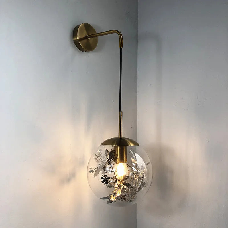Glass wall lamp with floral pattern in choice of golden or silver finish
