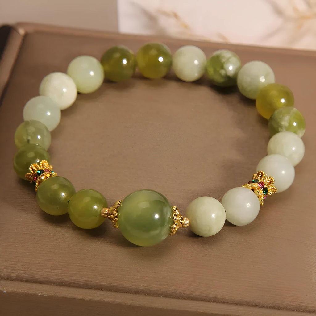 Women's bracelet made of natural green Xiuyan jade in a sweet Mori style.