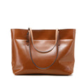 Genuine cowhide leather cross-body handbag showing two compartments and available in five colours