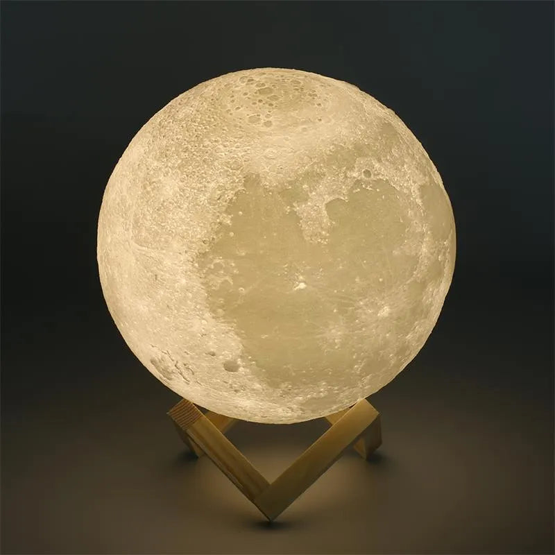 3D printed white moon lamp with textured surface on a wooden stand, showing touch ring at base.