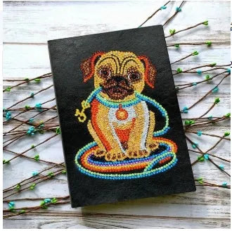Black A5 DIY diamond painting notebook with blank pages, shown closed and open.