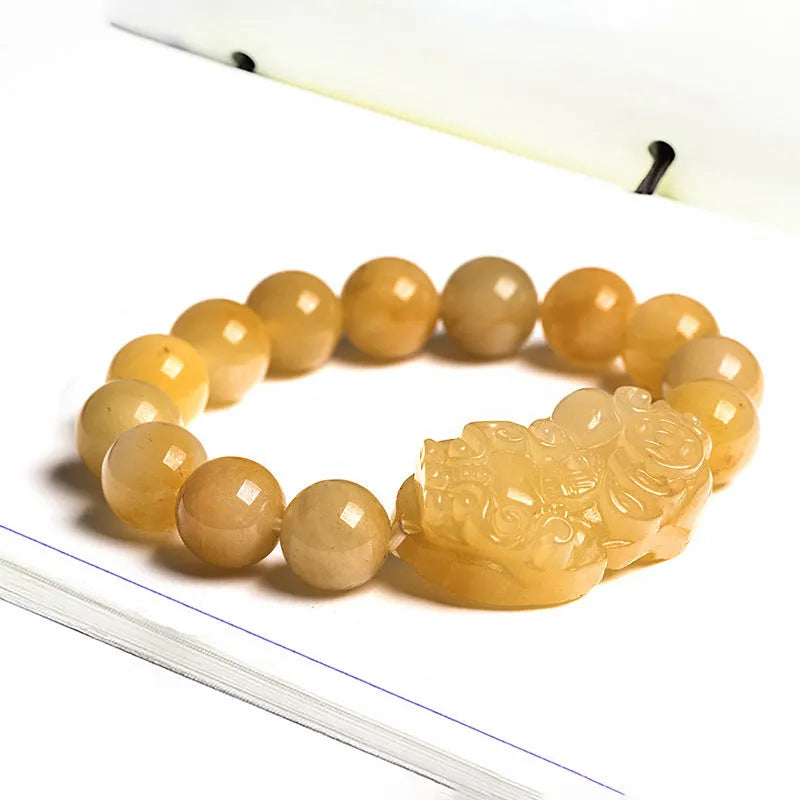 Golden thread Jinsi Jade money bracelet with carved coin charms on beaded strand