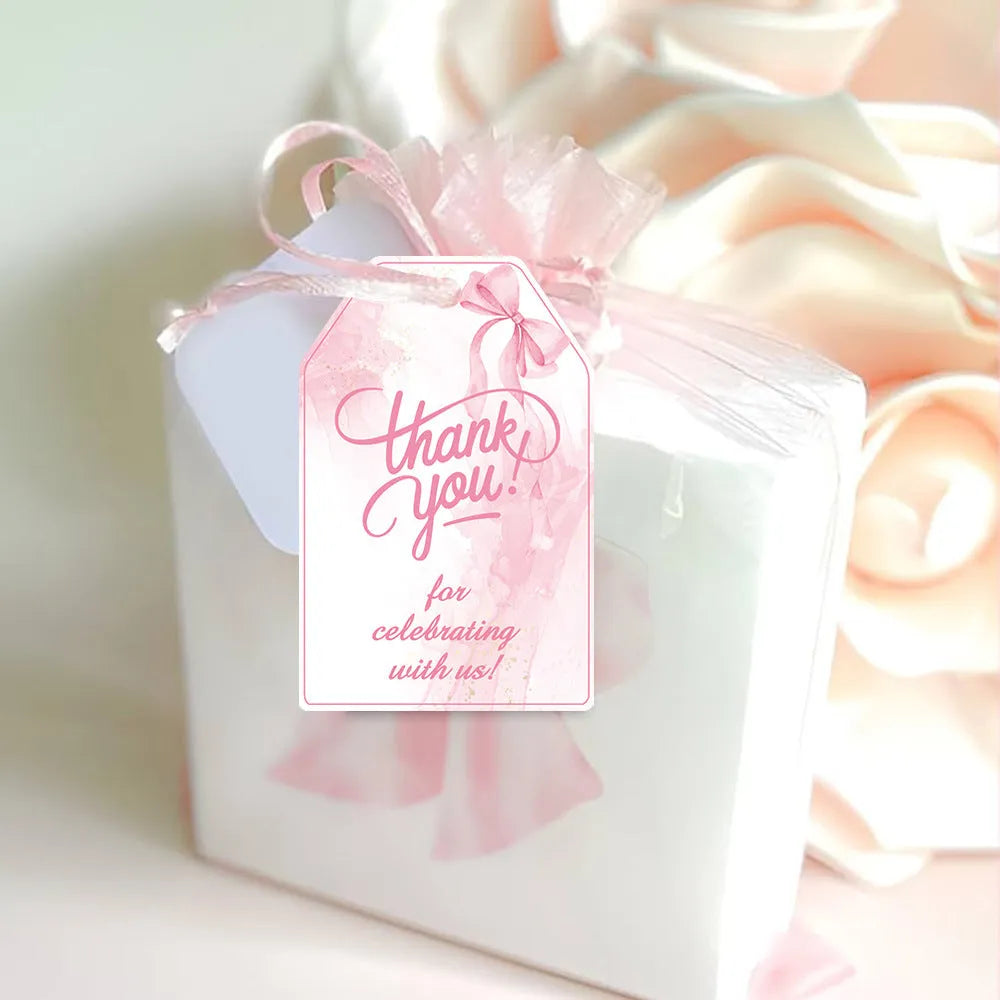 Set of 60 paper birthday gift tags with bowknot designs and natural hemp rope.