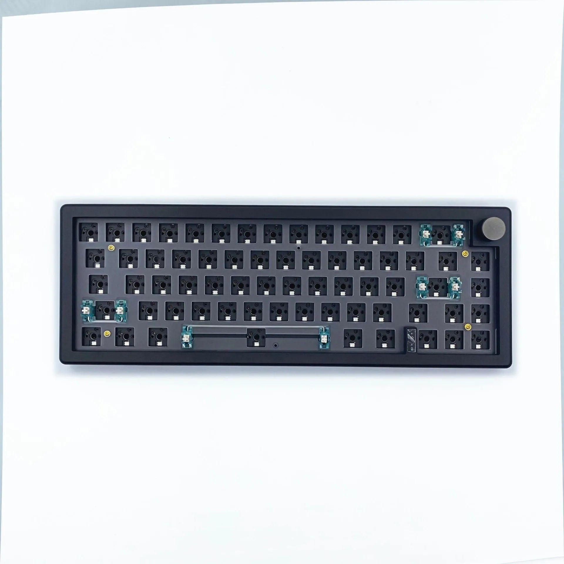 DIY hot-swappable RGB mechanical keyboard kit with ABS chassis, rotary knob, and USB cable in multiple colours.