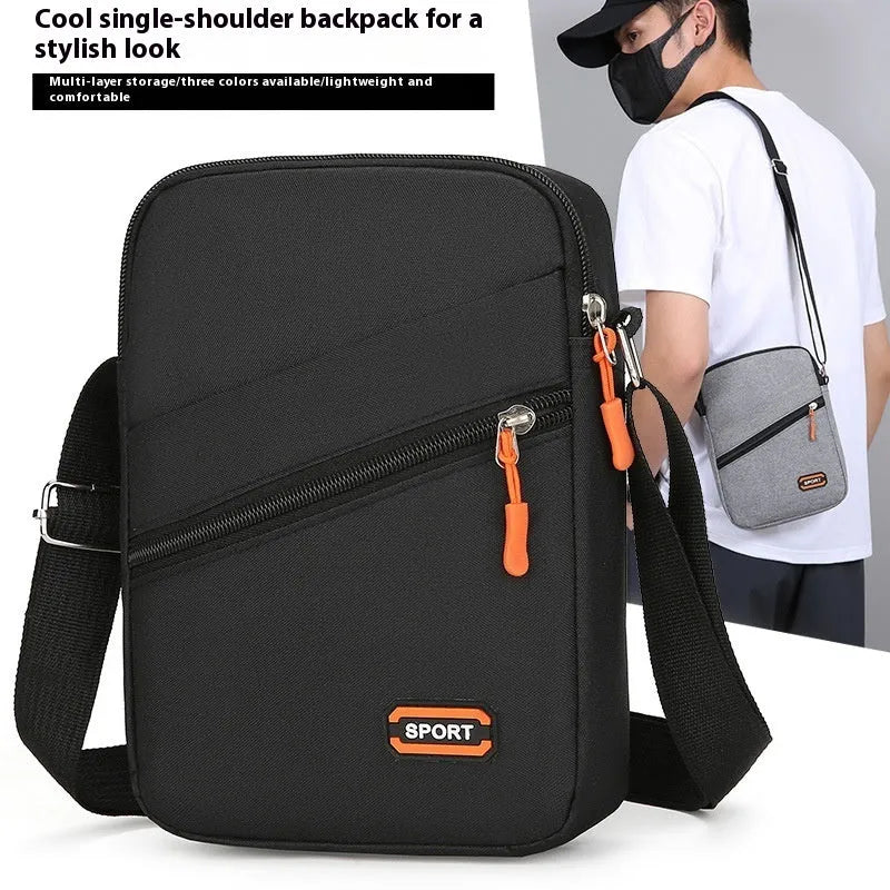 Solid colour Oxford cloth crossbody commuter bag with contrast details in silver grey.