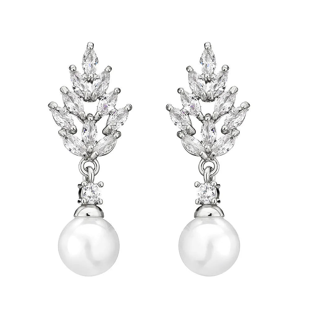 Geometric flower shaped earrings with micro inlaid zircon stones and pearl accents on a gold plated background.