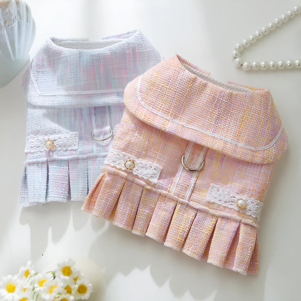 Purple or pink polyester pet clothing for a small dog or cat, showing size options S, M, L, XL.