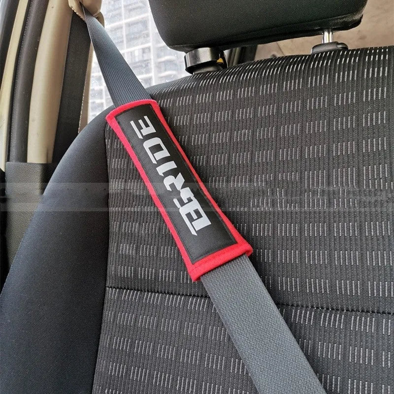 Car seatbelt shoulder pads with embroidery detail in black, blue, and red colour options