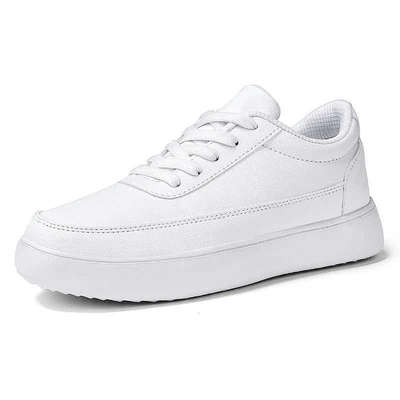 Women's white leather lace-up flat casual shoes on a neutral background.