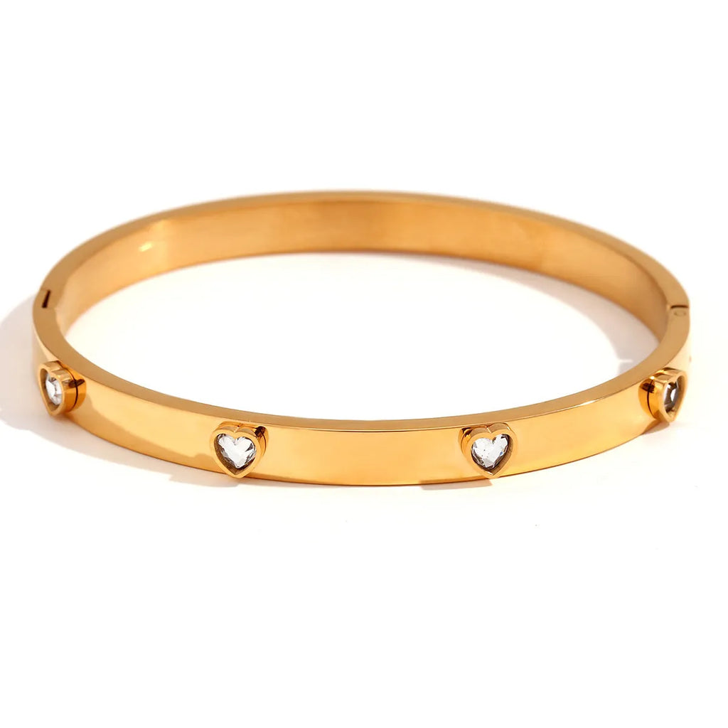 Stainless steel women's bracelet with peach heart design and micro-inlaid detailing in electroplated golden colour