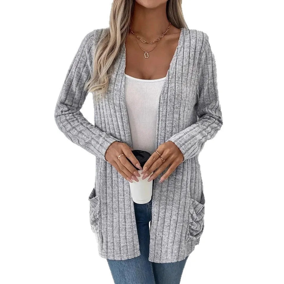 Solid colour loose fitting long sleeve cardigan with front pockets in Grandma grey