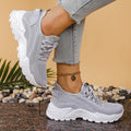 Women's low-top flyknit-style mesh sports shoes in multiple colours on a white background.