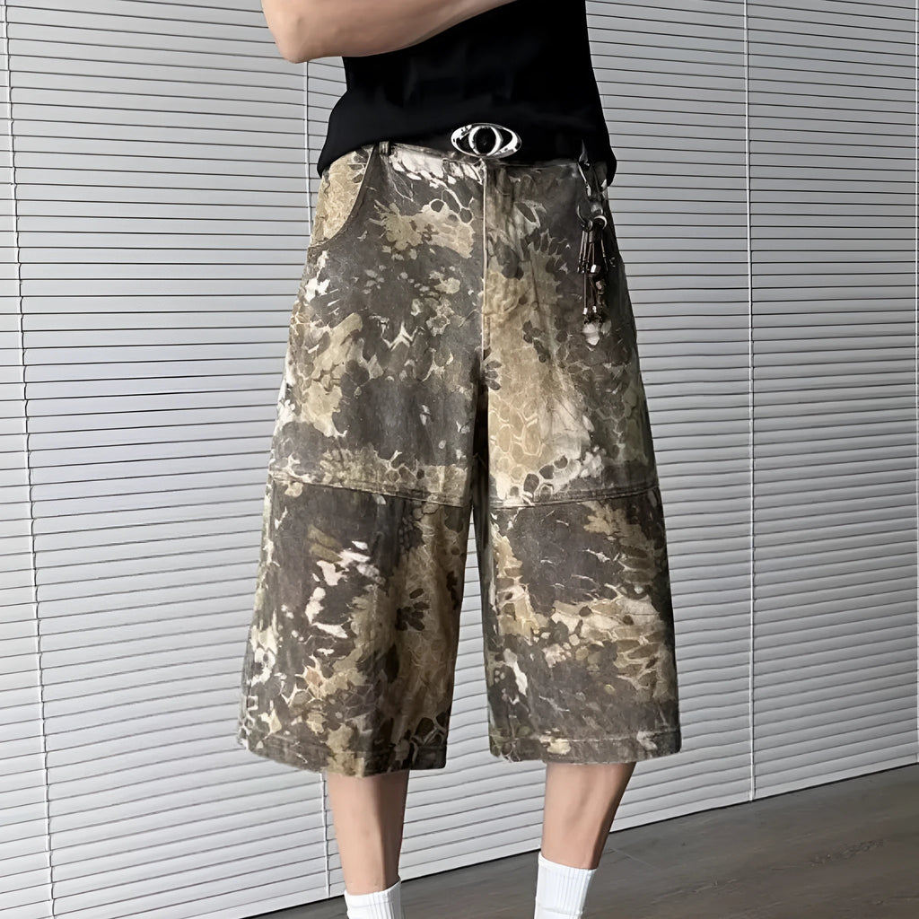 Yellow women's jeans with snake camouflage print, cropped length, and high waist.