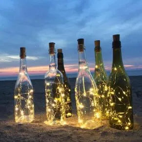 Copper wire LED string light with 20 bulbs inserted into a wine bottle for decorative lighting