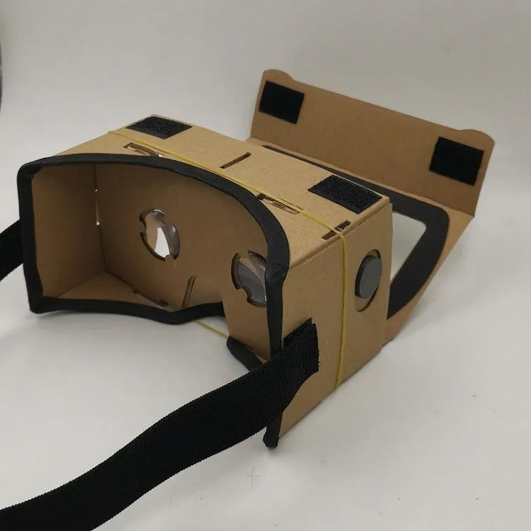Pink and white VR cardboard glasses viewer for smartphones with adjustable head strap.