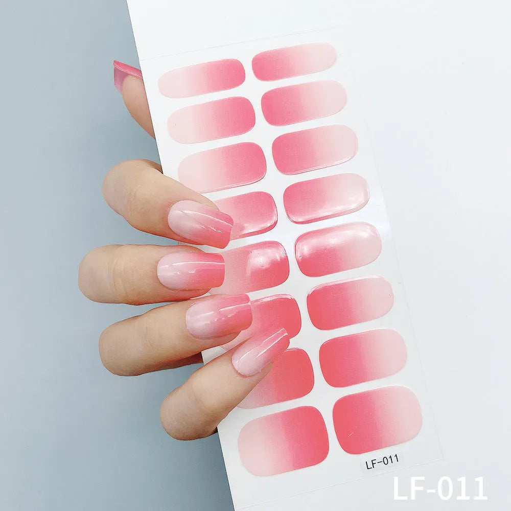 Full coverage nail art stickers sheet with 16 designs including cross, rose, tulip, and cartoon patterns.
