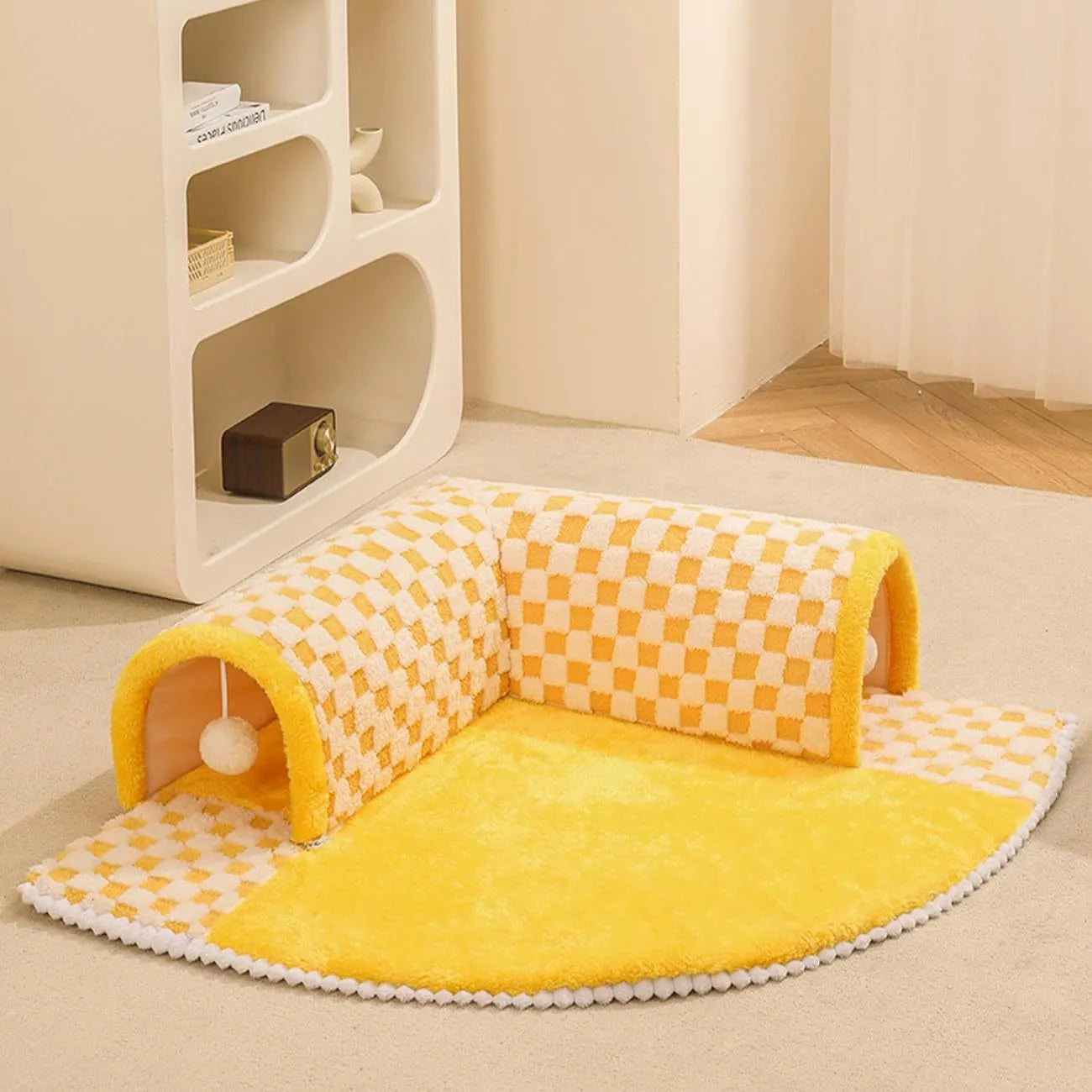 Fan-shaped plaid pet bed with integrated tunnel for dogs and cats in coffee colour, showing soft plush fabric.