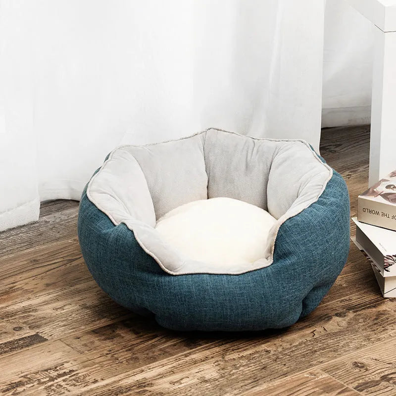 Blue octagonal pet bed for small dog with high sides and removable interior mat.
