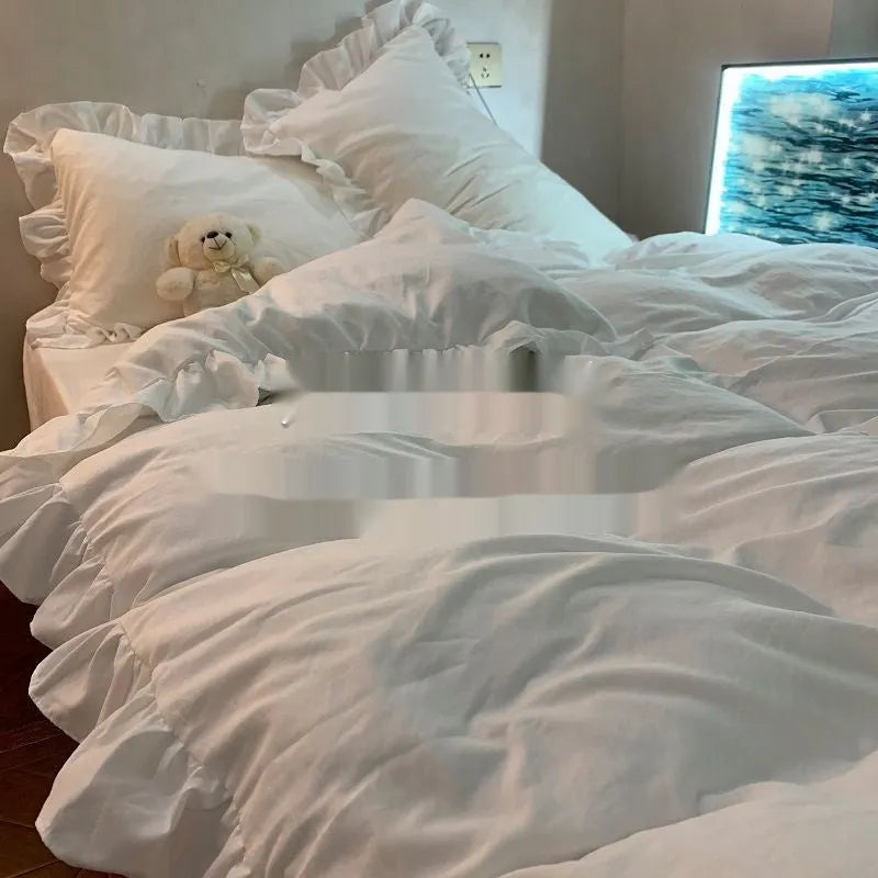 Washed cotton four-piece bedding set in Mori style showing lace-trimmed solid colour options