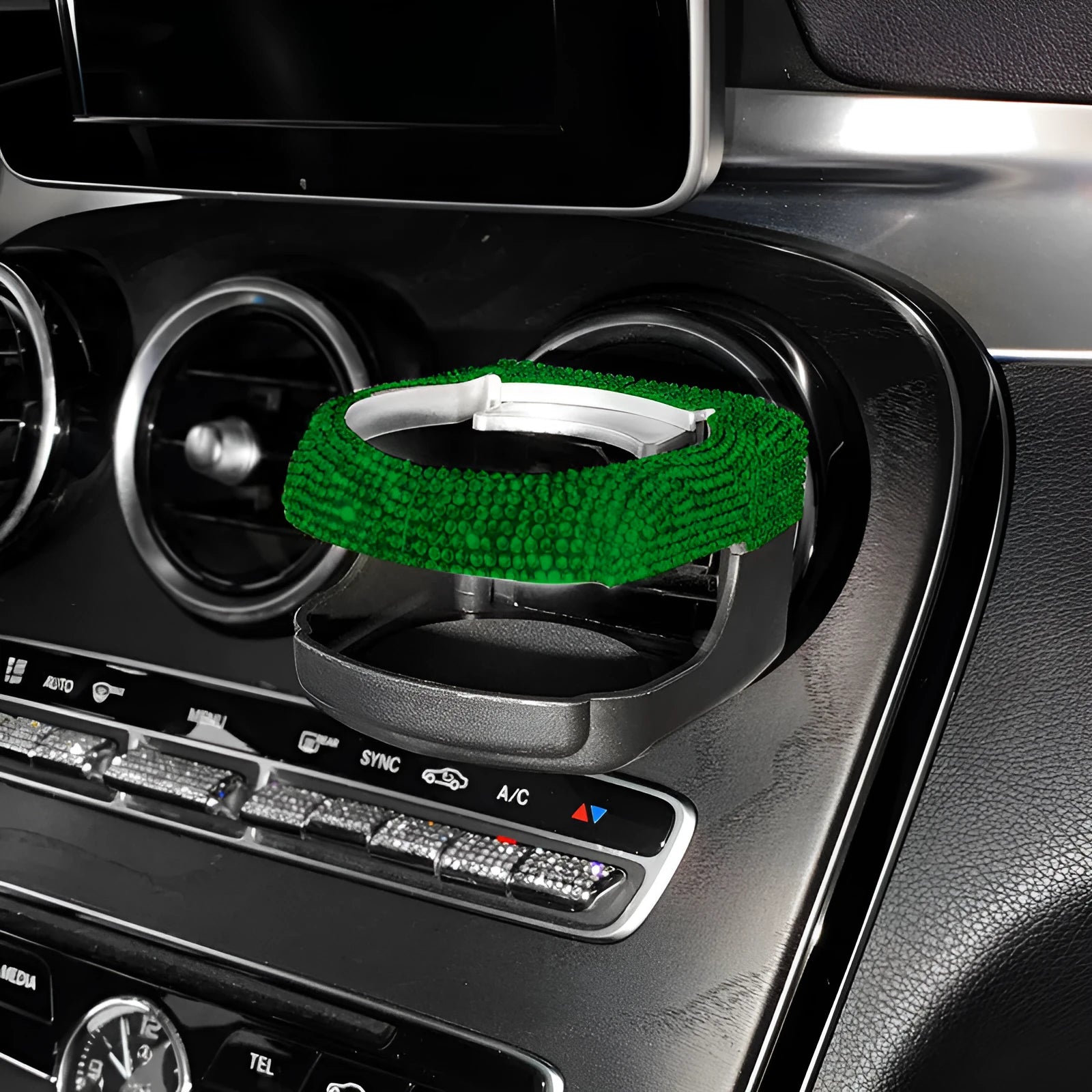 Sparkling rhinestone car cup holder bracket clipped to a vehicle air vent, shown in pink diamond colour.