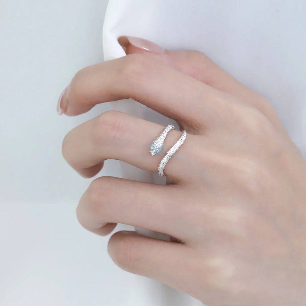 Adjustable snake ring with electroplated white gold colour finish and zodiac design