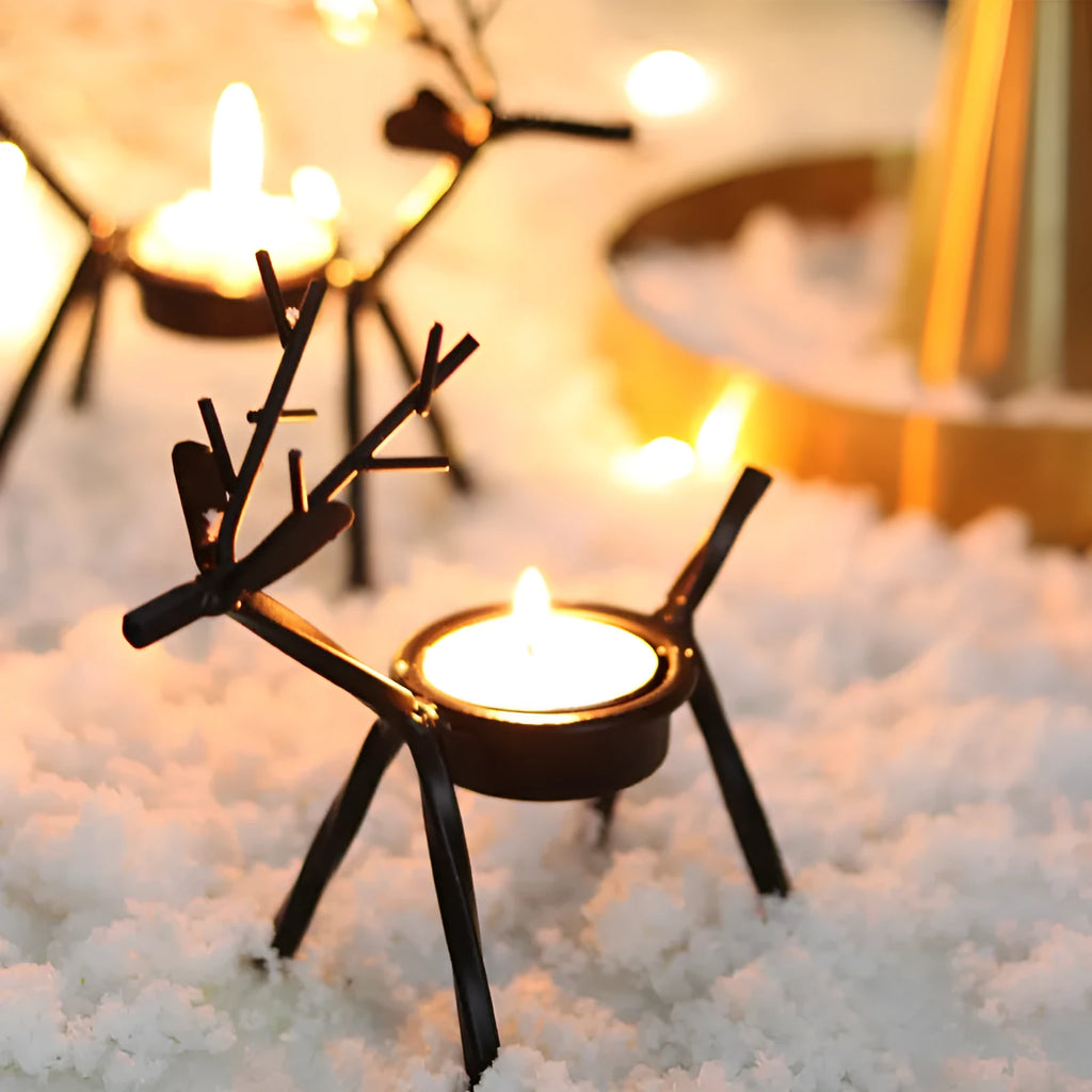 Black iron elk Christmas candlestick holder on table with candle