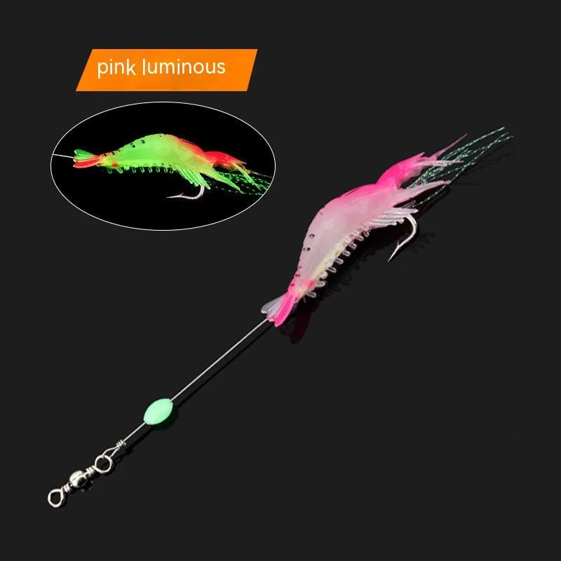 Six soft fishing lures with hooks in colours including black head yellow body, pink luminous, and red head yellow body.