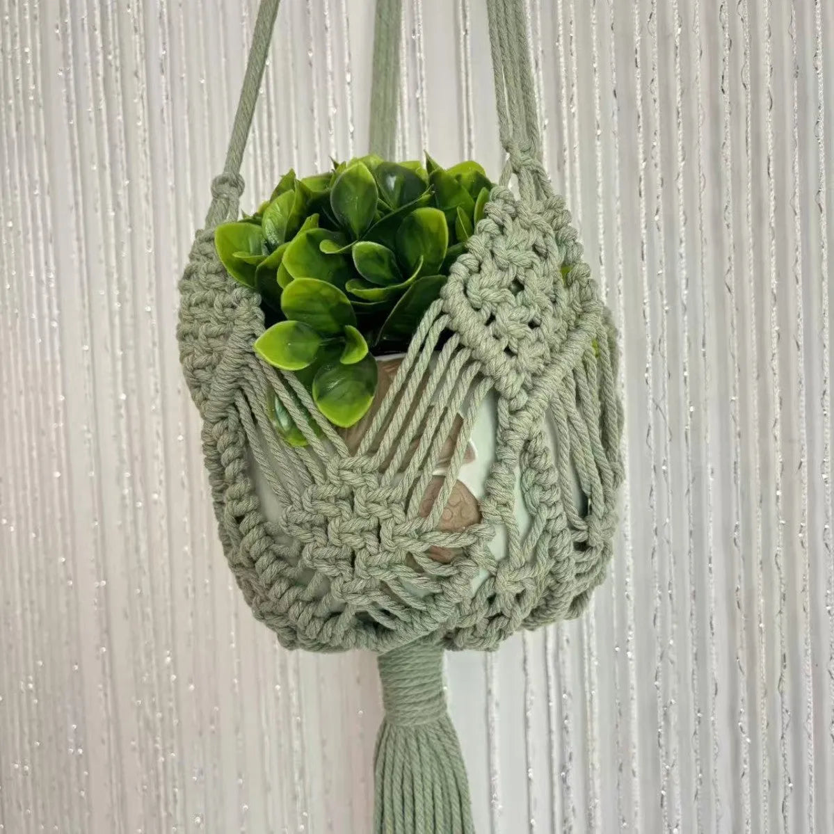 Hand-woven minimalist flower pot in polyester cotton showing net pocket extension cord design