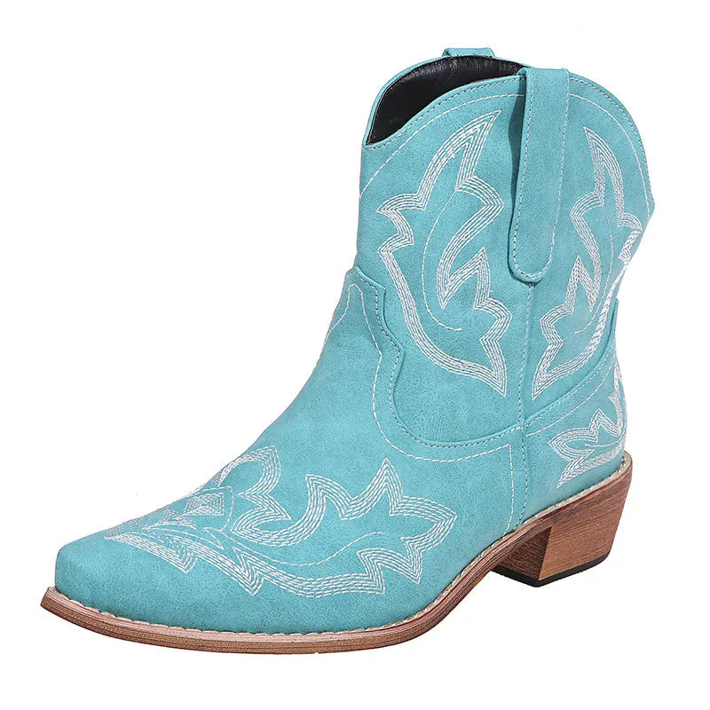Women's blue embroidered cowboy boots with low chunky heel and pointed toe.