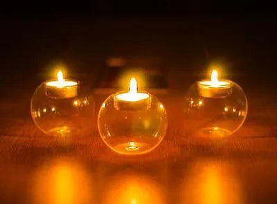 Round hollow glass candle holder showing handcrafted European-style spherical design