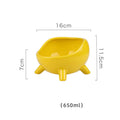 Green ceramic pet food bowl with four legs and a wide, rounded opening.