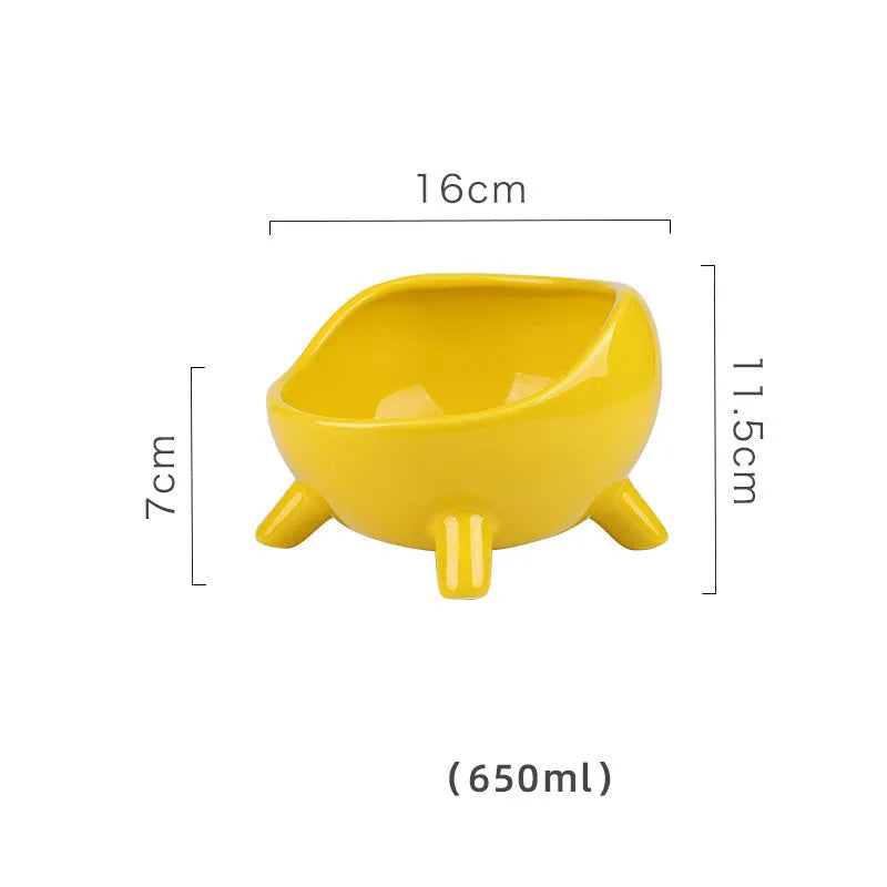 Green ceramic pet food bowl with four legs and a wide, rounded opening.