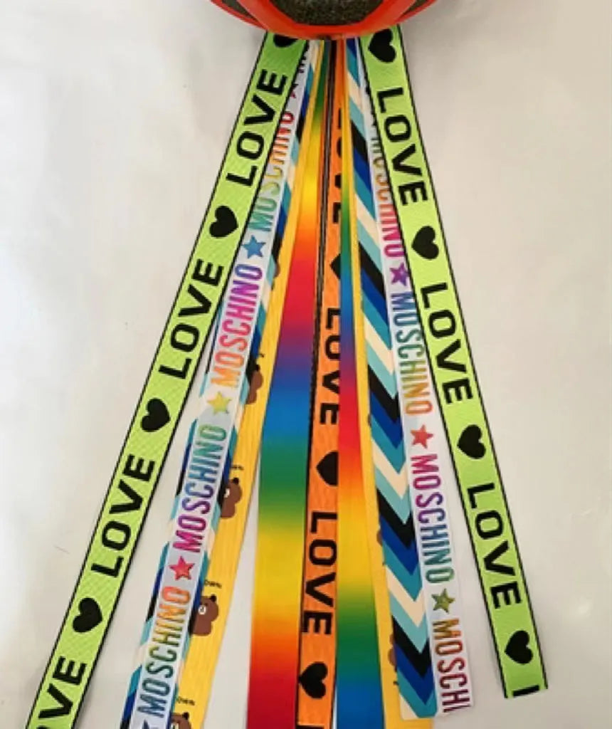 Decorative ribbon streamer for a child's ski or skating helmet in various colour options.