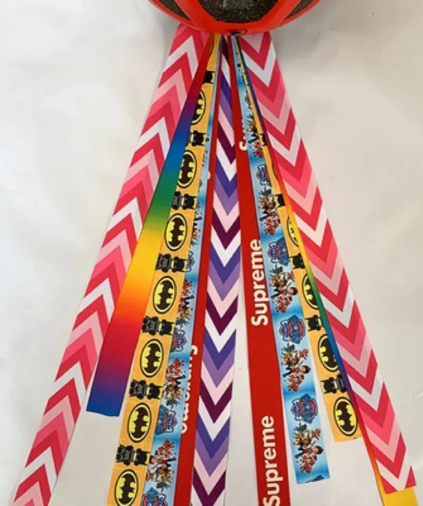 Decorative ribbon streamer for a child's ski or skating helmet in various colour options.