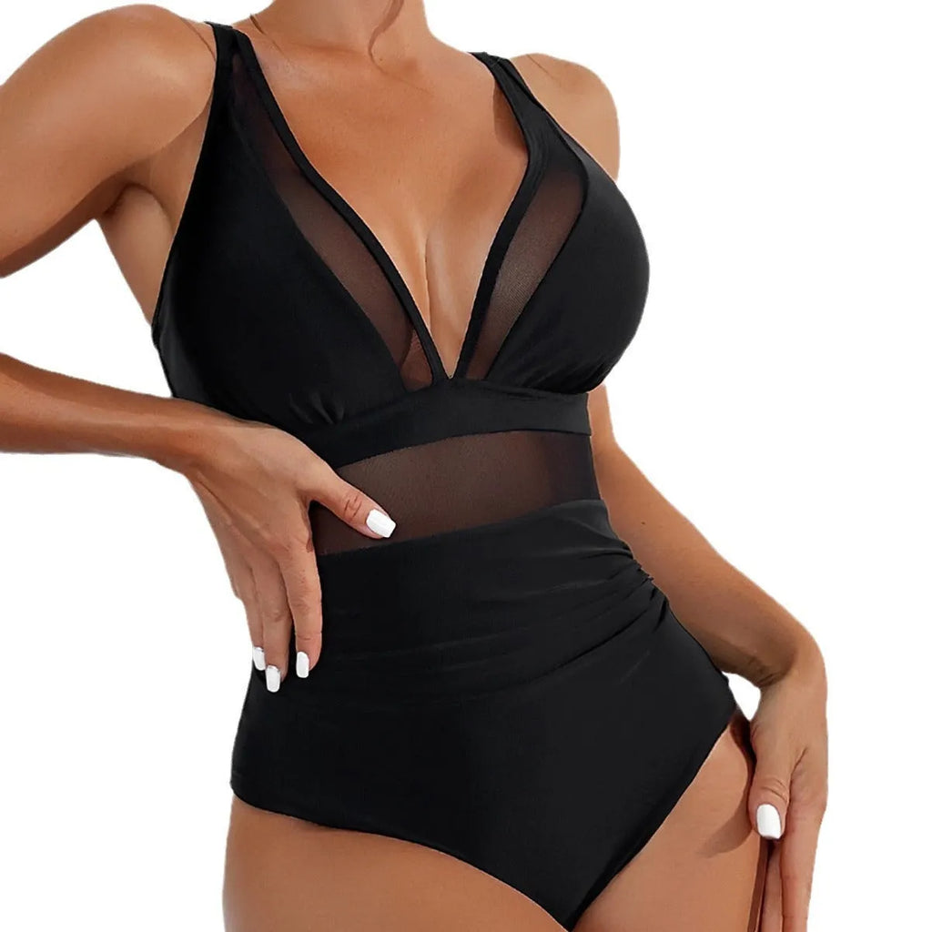 Black women's halter neck one-piece swimsuit with mesh detailing and briefs style cut