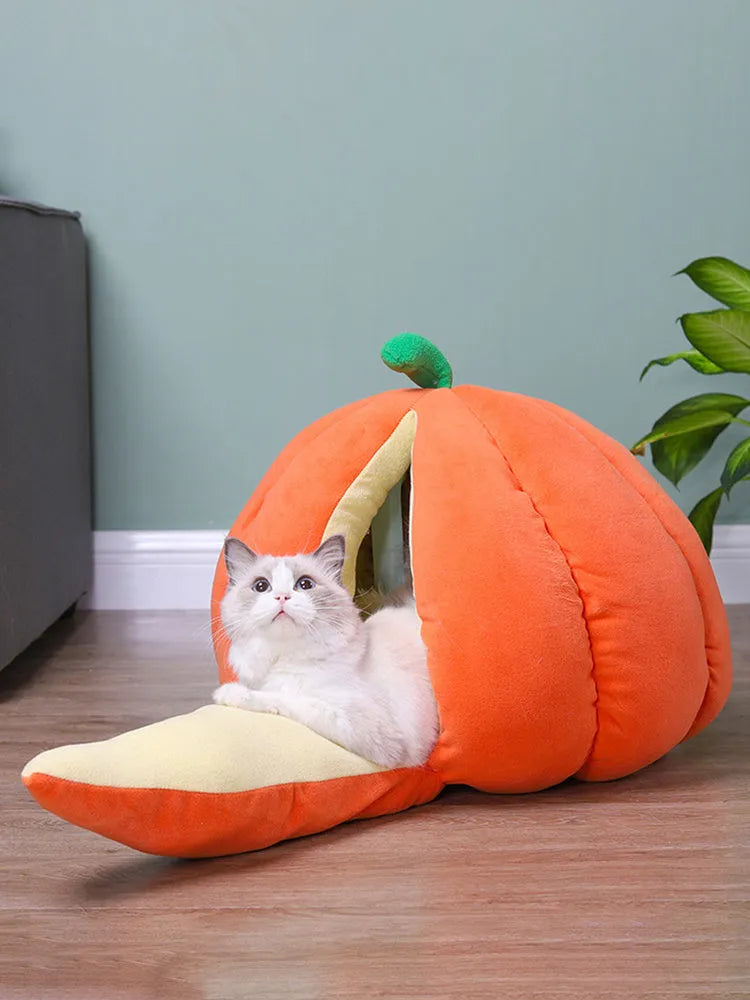 Pumpkin-shaped winter pet bed in orange, closed cave design for cats and small dogs, soft coral fleece fabric.