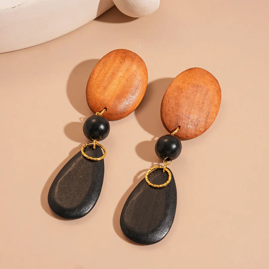 Handmade wooden ellipse earrings in silver needle brown black colour, retro fashion style.