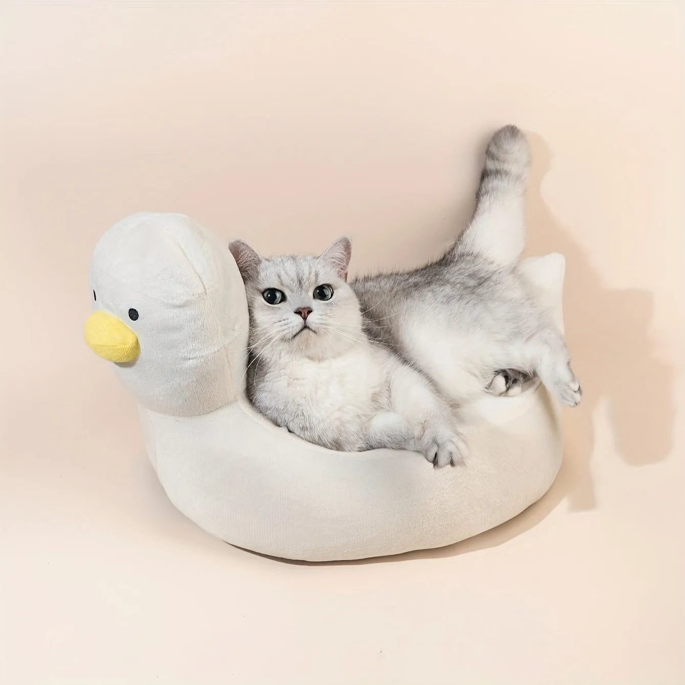 Duck-shaped fluffy pet bed for small dogs and cats in blue or white