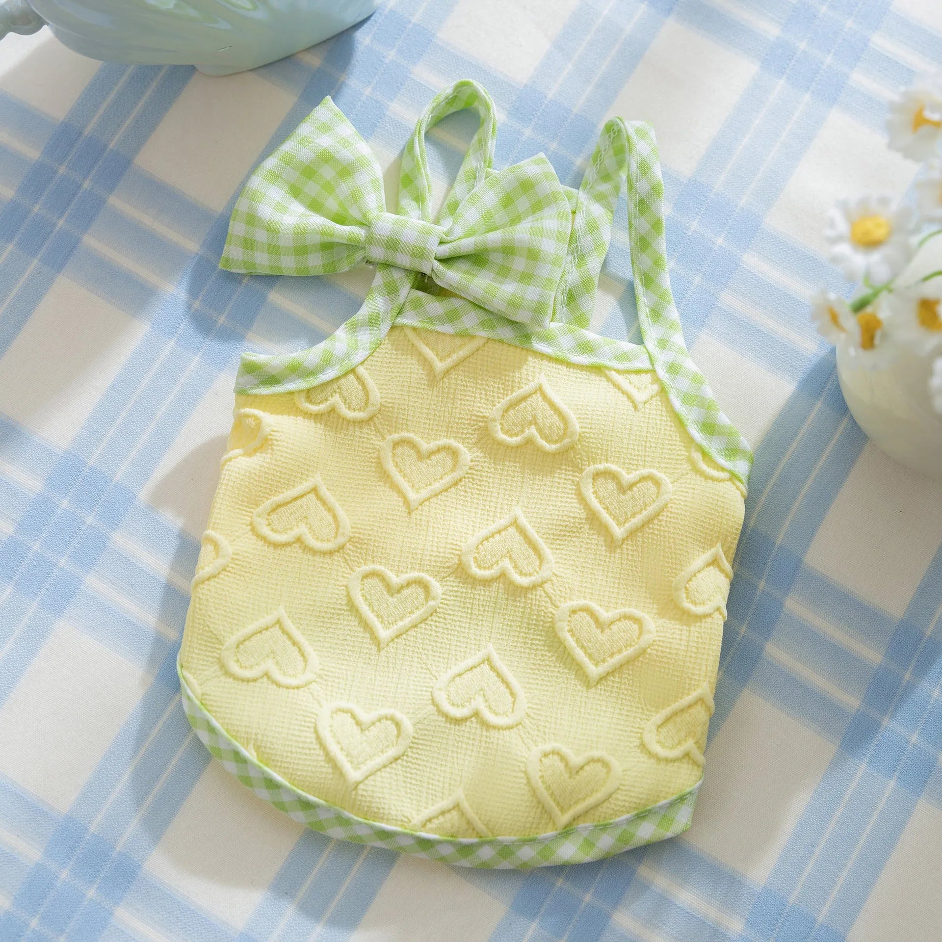 Small dog vest with heart relief texture bow suspenders in elastic polyester fabric