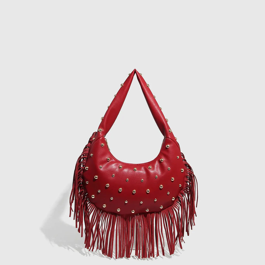 Retro black shoulder handbag with tassel detail and internal mobile phone pocket.