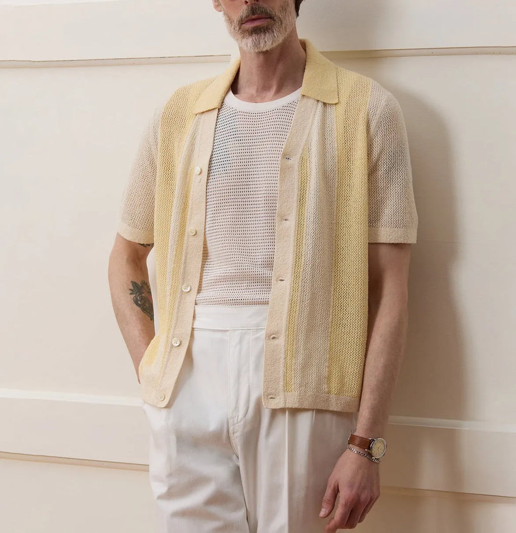 Yellow asymmetric casual polo shirt with hollow-out detail and short sleeves, made from Tencel fabric.