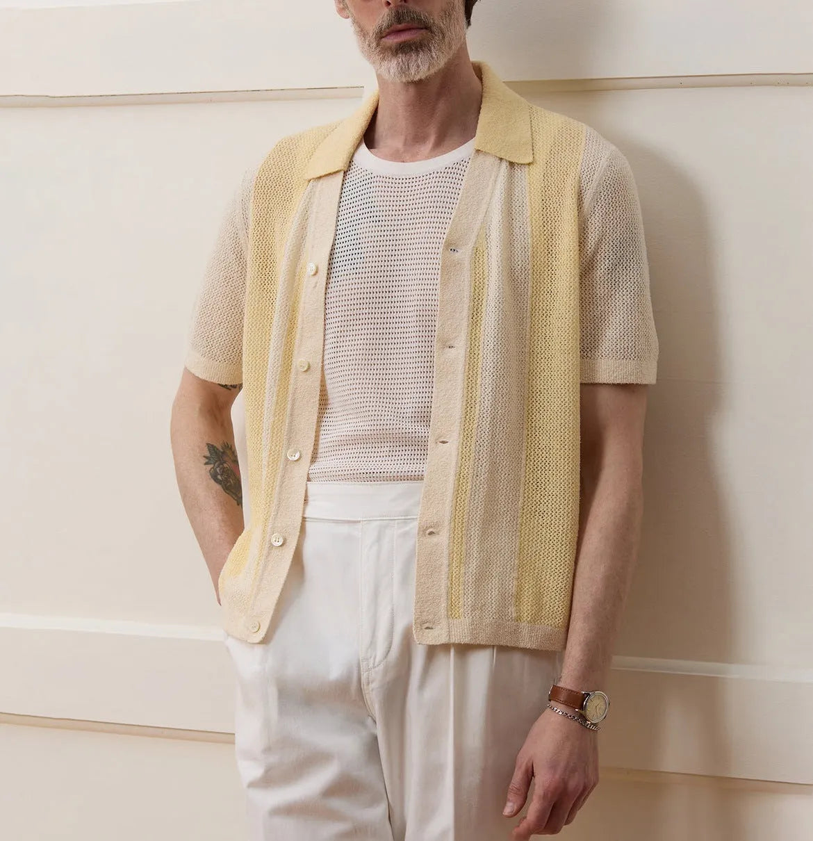 Yellow asymmetric casual polo shirt with hollow-out detail and short sleeves, made from Tencel fabric.