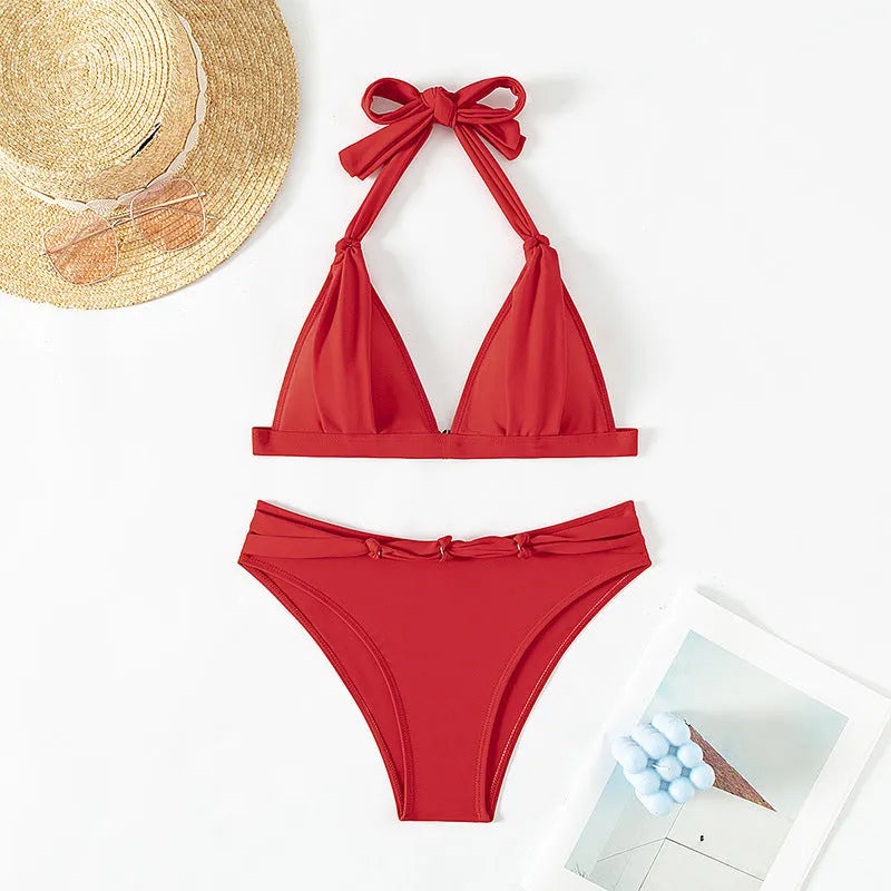 Red women's bikini with lace-up halterneck top and split shorts