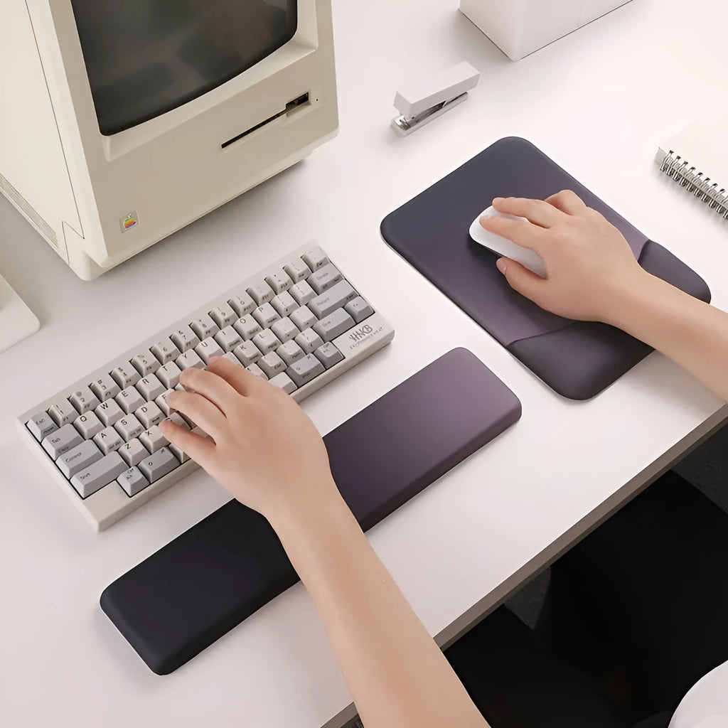 Square silicone gel wrister mouse pad with wrist strap on cloth surface measuring 250mm by 180mm