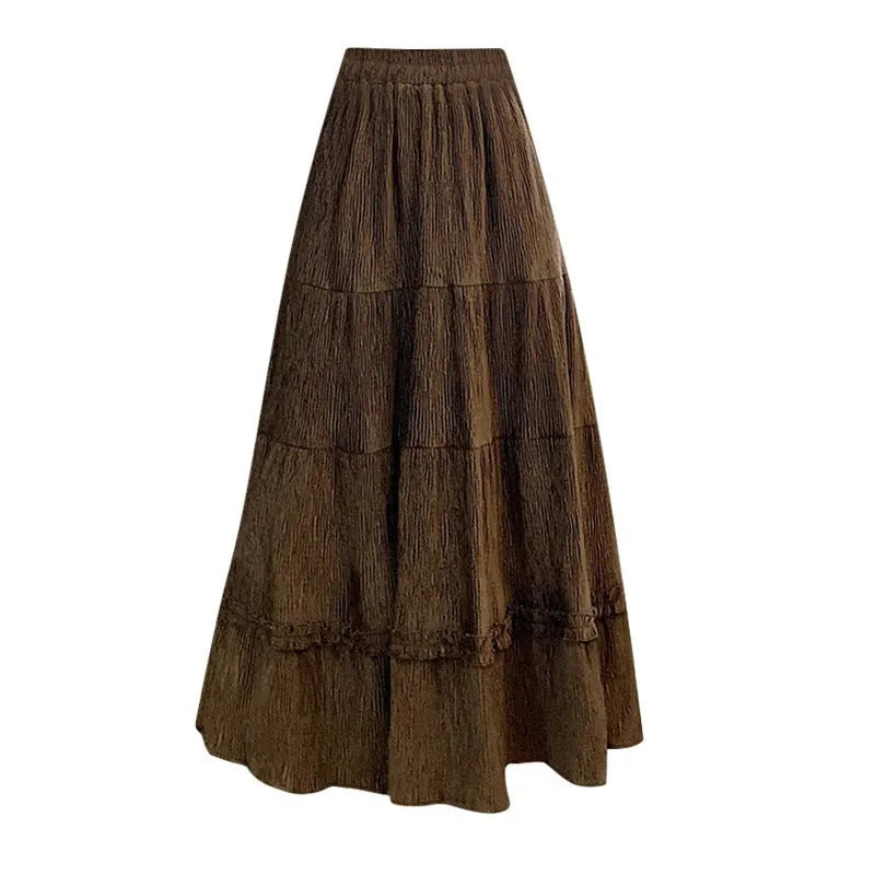 Korean style beige corduroy A-line midi skirt with an elastic waistband on a hanger.