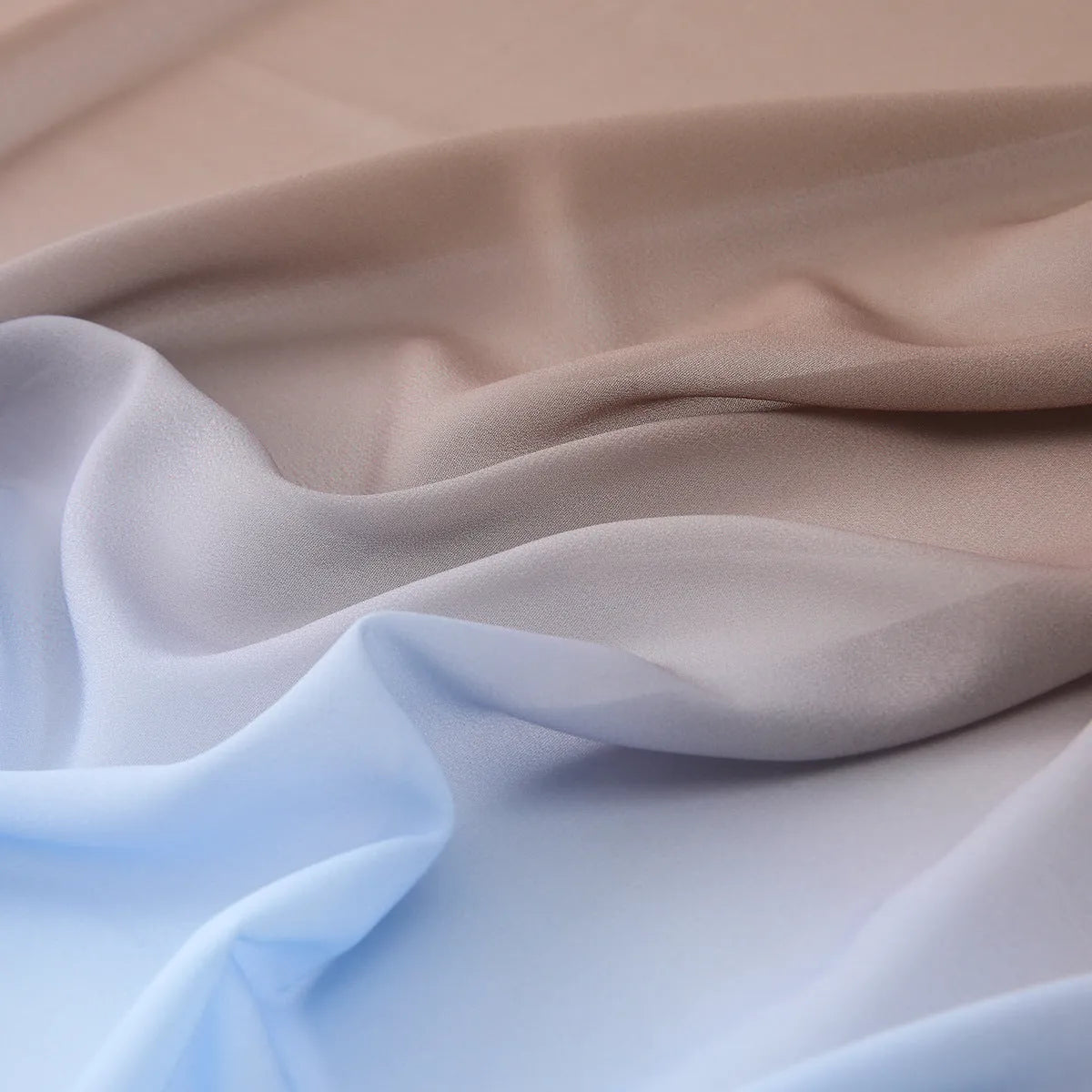 Lightweight chiffon bubble towel texture scarf for women in a summer colour, showing its length.