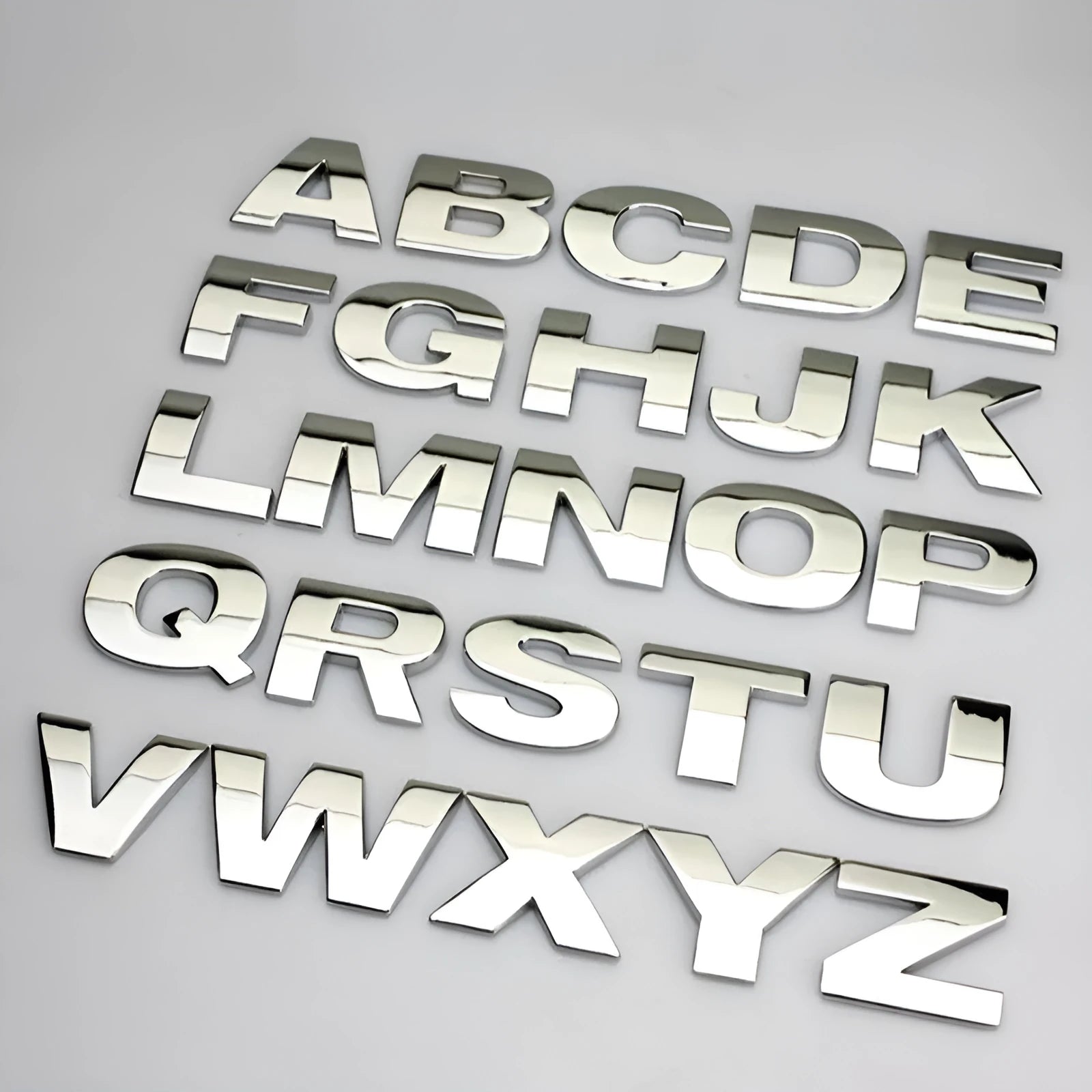 Zinc alloy 3D car bumper sticker showing raised metallic letter on black background